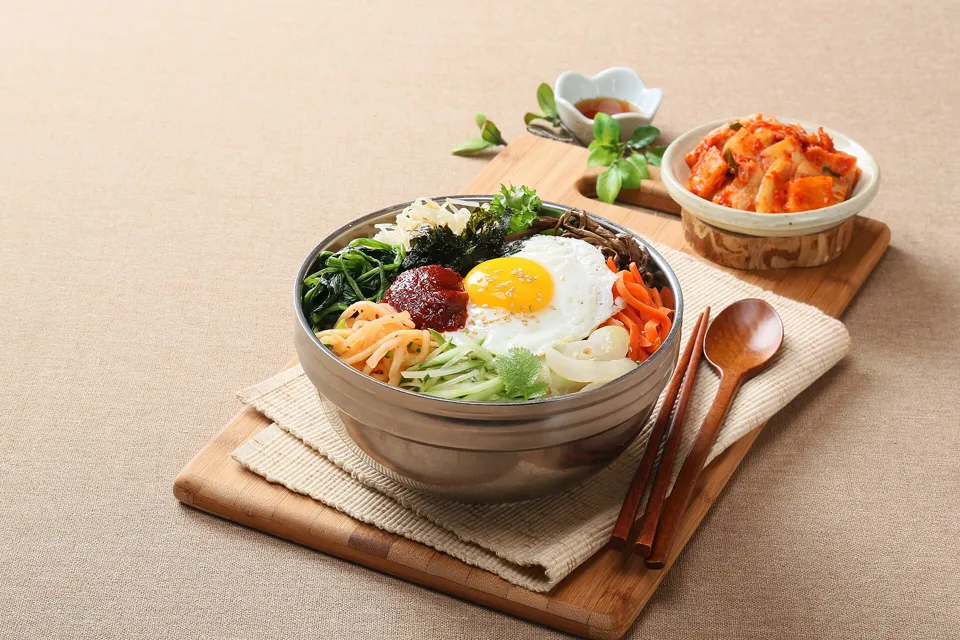 Bibimbap served with cubed radish kimchi